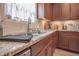 Kitchen with stainless steel sink, light granite countertops and custom cabinets at 15 Masters Dr, Villa Rica, GA 30180
