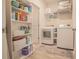 Bright laundry room with built-in shelves and included washer/dryer at 15 Masters Dr, Villa Rica, GA 30180