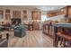 Open-concept living room features hardwood floors and opens to the kitchen and breakfast bar at 15 Masters Dr, Villa Rica, GA 30180