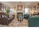 Comfortable living room features hardwood floors, modern furniture, a fireplace, and decorative artwork at 15 Masters Dr, Villa Rica, GA 30180