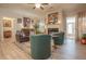 Bright living room features hardwood floors, modern furniture, artwork, fireplace, and access to the outdoors at 15 Masters Dr, Villa Rica, GA 30180