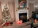 Beautiful living room decorated for Christmas with tree, fireplace, and festive decorations at 15 Masters Dr, Villa Rica, GA 30180