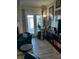 Inviting living room showcasing sleek wood floors and natural light from the exterior door at 15 Masters Dr, Villa Rica, GA 30180