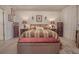 This primary bedroom features hardwood floors, modern lamps, and decorative artwork throughout at 15 Masters Dr, Villa Rica, GA 30180