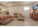 The primary bedroom features hardwood floors, decorative artwork, and a comfortable seating area at 15 Masters Dr, Villa Rica, GA 30180