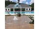 Community pool featuring a splashpad with frog statues and a covered seating area with columns at 15 Masters Dr, Villa Rica, GA 30180