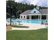 Community pool features ample seating and a covered seating area with columns at 15 Masters Dr, Villa Rica, GA 30180