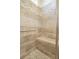 Walk-in shower features built-in bench and decorative tile surround at 15 Masters Dr, Villa Rica, GA 30180