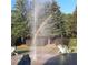 Community splashpad features statues of frogs shooting water on a sunny day with a rainbow at 15 Masters Dr, Villa Rica, GA 30180
