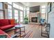 Bright and airy sunroom with a brick fireplace, casual seating, and many windows at 15 Masters Dr, Villa Rica, GA 30180