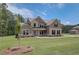 Beautiful two-story home with a spacious lawn, tasteful landscaping, and a serene suburban setting at 21 Homesite Cooper E Cv, Fayetteville, GA 30215