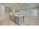 Bright, open kitchen with grey cabinets, white countertops, and stainless steel appliances at 21 Homesite Cooper E Cv, Fayetteville, GA 30215