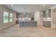 Elegant kitchen with gray cabinets, a center island, and natural lighting at 21 Homesite Cooper E Cv, Fayetteville, GA 30215