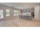 Bright modern kitchen with island, gray cabinets, and stainless steel appliances at 21 Homesite Cooper E Cv, Fayetteville, GA 30215