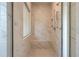 New tile shower with shower head, bench seat, and glass door enclosure at 21 Homesite Cooper E Cv, Fayetteville, GA 30215