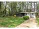 Charming single-story home with a well-manicured lawn and lush landscaping creating a serene curb appeal at 2191 Camp Ground Rd, Atlanta, GA 30331