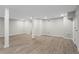 Spacious finished basement with light paint, recessed lighting, and durable wood-look flooring at 2310 Rubart Dr, Marietta, GA 30066