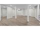 Spacious finished basement with recessed lighting and wood-look flooring at 2310 Rubart Dr, Marietta, GA 30066