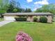 Charming single-story brick home featuring an attached two-car garage and a well-maintained front lawn at 2310 Rubart Dr, Marietta, GA 30066
