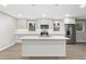 Bright, modern kitchen features an island, stainless steel appliances, and white cabinets at 2310 Rubart Dr, Marietta, GA 30066