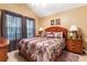 Bedroom featuring vaulted ceilings, a window with curtains and two wood nightstands at 3344 Timbersedge Dr # 5, Marietta, GA 30064