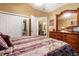 Bedroom featuring vaulted ceilings, closet and wood dresser with view into dining room at 3344 Timbersedge Dr # 5, Marietta, GA 30064