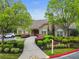 Charming stone clubhouse nestled among lush landscaping with mature trees and inviting walkway at 3344 Timbersedge Dr # 5, Marietta, GA 30064