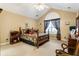 Vaulted ceiling bedroom with a ceiling fan and window with patterned curtains at 3344 Timbersedge Dr # 5, Marietta, GA 30064