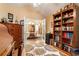 Home office with French doors, bookshelf, area rug and views into dining room at 3344 Timbersedge Dr # 5, Marietta, GA 30064