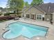 Community pool with lounge chairs surrounded by lush landscaping at 3344 Timbersedge Dr # 5, Marietta, GA 30064
