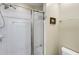Bright shower with white tiles and sliding glass door, plus grab bars and a shower seat at 3344 Timbersedge Dr # 5, Marietta, GA 30064