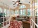 Bright sunroom features vaulted ceilings, a ceiling fan, and a neutral color palette, perfect for relaxation at 3344 Timbersedge Dr # 5, Marietta, GA 30064