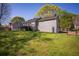 Well-kept backyard featuring a lush lawn and a charming deck, perfect for outdoor entertaining at 670 Maplelake Dr, Acworth, GA 30101