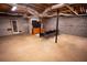 Spacious unfinished basement with concrete flooring and an exposed ceiling at 670 Maplelake Dr, Acworth, GA 30101