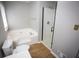 Bright bathroom features a combined tub and shower, toilet, and a large soaking tub for relaxing at 670 Maplelake Dr, Acworth, GA 30101