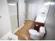 Modern bathroom with walk-in shower, a toilet, and a sink with a cabinet below for storage at 670 Maplelake Dr, Acworth, GA 30101