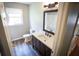 Bathroom with a sink, vanity, modern fixtures, and natural light at 670 Maplelake Dr, Acworth, GA 30101