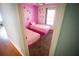 Pink bedroom featuring two twin beds with plush pink bedspreads at 670 Maplelake Dr, Acworth, GA 30101