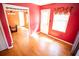 Orange dining room with window and doorway to the kitchen at 670 Maplelake Dr, Acworth, GA 30101