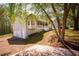 View of charming home with a white porch, showcasing an attached two-car garage and well-kept landscaping at 670 Maplelake Dr, Acworth, GA 30101