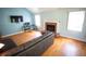 Inviting living room features a brick fireplace, hardwood floors, and a spacious layout at 670 Maplelake Dr, Acworth, GA 30101