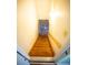 Stairwell leading to a basement area with wooden steps and white painted walls at 670 Maplelake Dr, Acworth, GA 30101