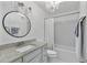 Stylish bathroom with granite countertop, updated fixtures and decorative lighting at 7650 Rico Rd, Chattahoochee Hills, GA 30268
