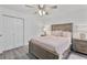 Cozy bedroom with wood-look floors, closet and a ceiling fan at 7650 Rico Rd, Chattahoochee Hills, GA 30268