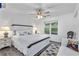 Bedroom with wood-look flooring, a large window, and coastal-themed decor at 7650 Rico Rd, Chattahoochee Hills, GA 30268