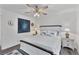 Bright bedroom with wood-look flooring and coastal-themed decor and accents at 7650 Rico Rd, Chattahoochee Hills, GA 30268