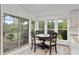 Cozy dining area with lake views, seamlessly connecting indoor and outdoor living spaces at 7650 Rico Rd, Chattahoochee Hills, GA 30268