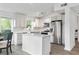 Bright eat-in kitchen features a center island, stainless steel appliances and granite countertops at 7650 Rico Rd, Chattahoochee Hills, GA 30268