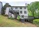 Expansive backyard featuring a large deck and stairs to a second story at 1043 Middlebrooke Dr, Canton, GA 30115