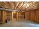 Open unfinished basement with visible insulation, utilities, and ample room for future development at 1043 Middlebrooke Dr, Canton, GA 30115